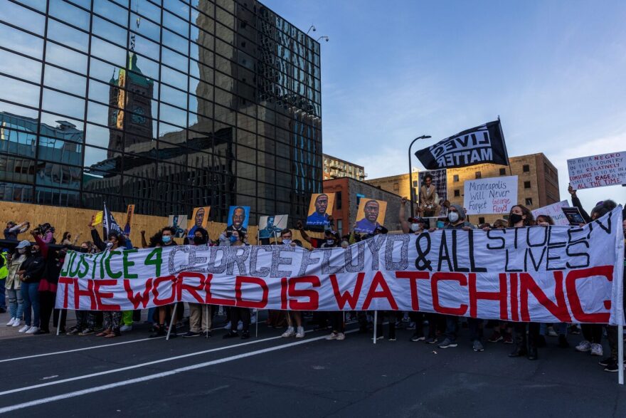 Demonstrators in Minneapolis march during a protest after the opening arguments in the murder trial of former police officer Derek Chauvin, who is on trial for the murder of George Floyd. 