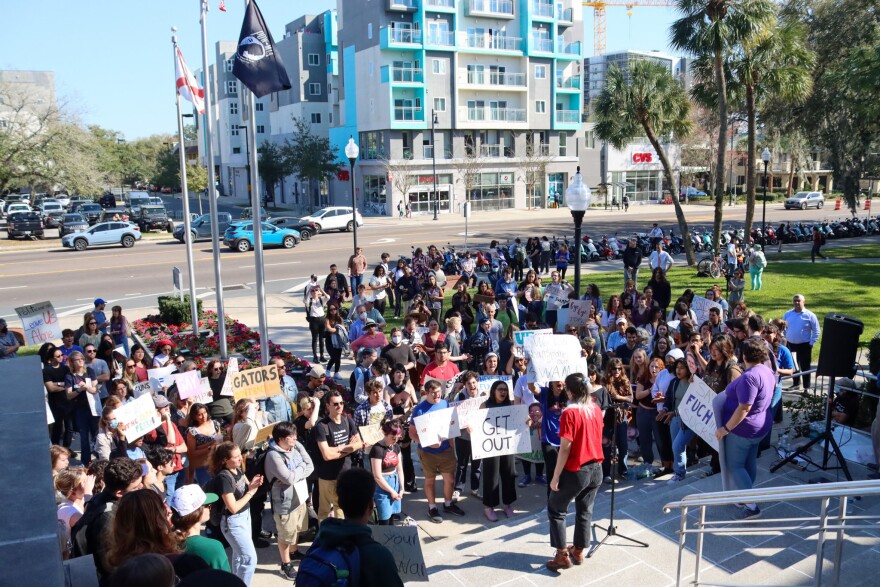 Bryn Taylor, Co-president for Graduate Assistants United, speaks to a crowd of over a hundred students, faculty and University members Feb. 6, 2023. The protesters shouted a list of 5 demands they expect from new UF president Ben Sasse. (Rae Riiska) Sasse Protest