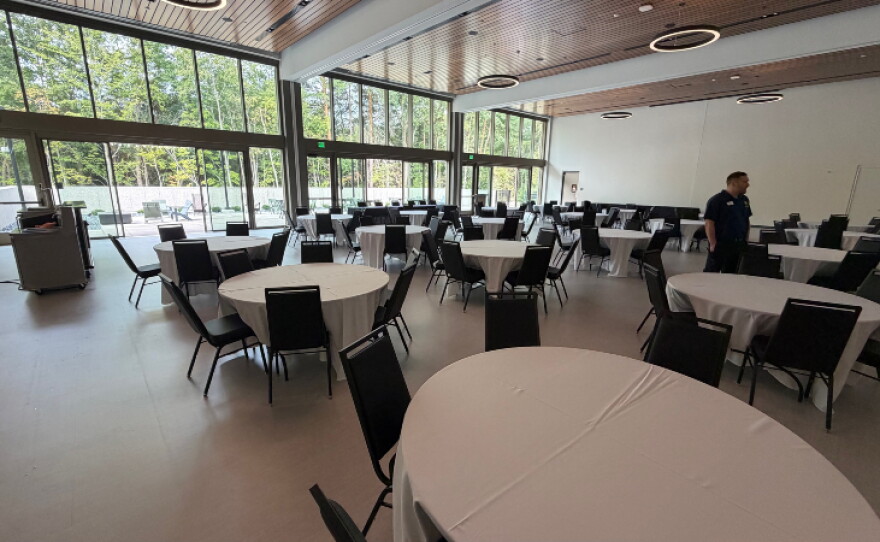 Amenities include three basketball courts, a one-mile indoor walking track, snack bar, fitness center, multi-sport simulator, playground, rentable event space, and child watch center.