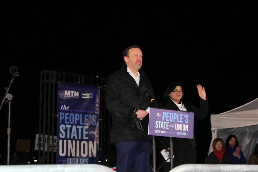 U.S. Sen. Chris Murphy speaks at the "People's State of the Union," a rally to counter President Donald Trump's State of the Union address. His guest Fereshteh Ganjavi of Elena’s Light stands to his right.