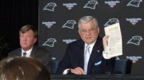 Panthers General Manager Marty Hurney (L) and owner Jerry Richardson