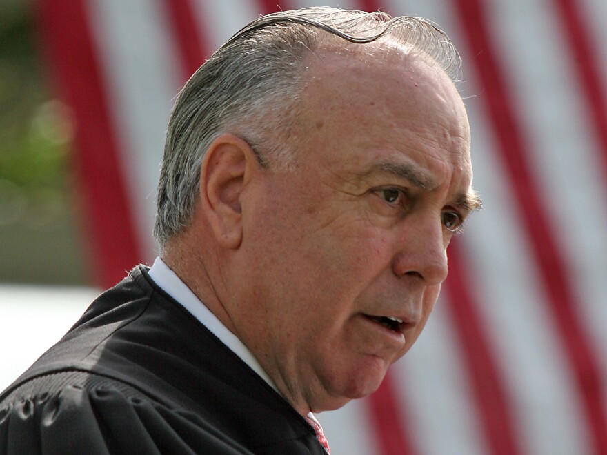 Judge T. S. Ellis III presides over a naturalization ceremony at Arlington National Cemetery in 2008.