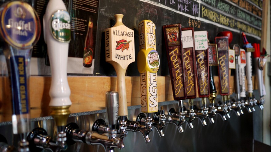 A row of taps highlights specialty and imported beers at Brouwerij Lane, in Brooklyn, New York. Craft brewers have found a way to thrive, even as the U.S. economy struggles.