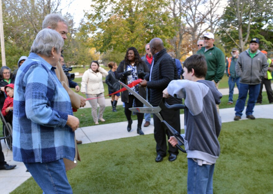 Jacob Manly prepares to cut the ribbon