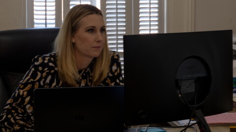 Lacey Thompson, a criminal defense attorney with an office in Columbia, works at her desk.