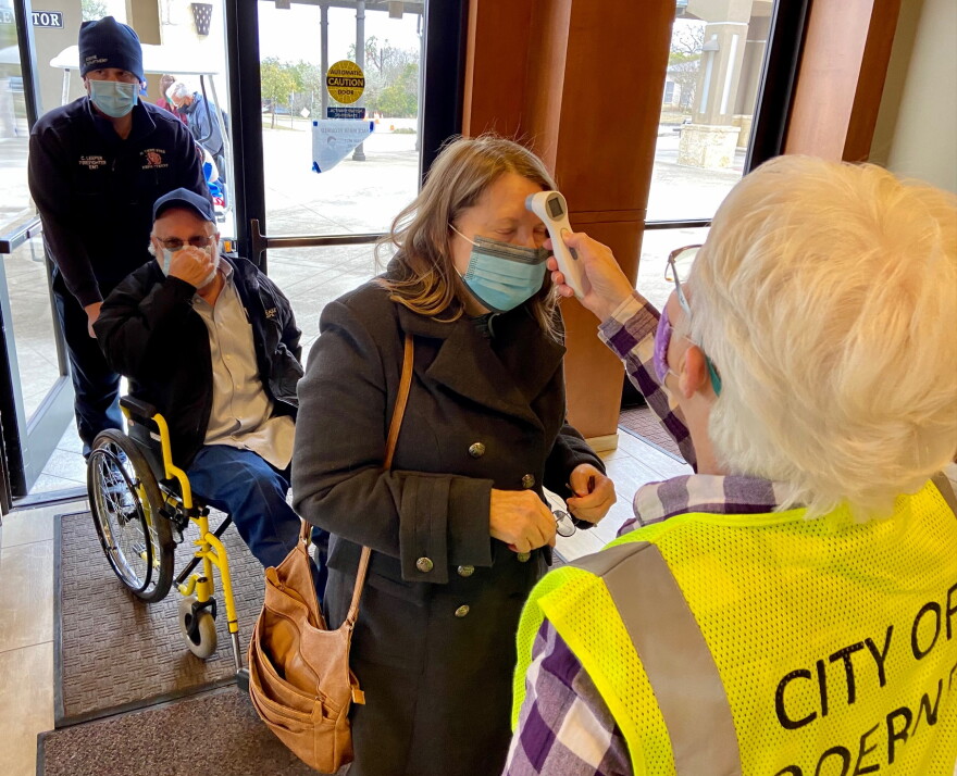 Temperatures checked at Boerne's Cana Ballroom mass COVID-19 vaccination
