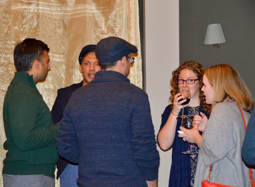 A group of people stand in a circle at a Stay to Stay event in Rutland, Vermont.