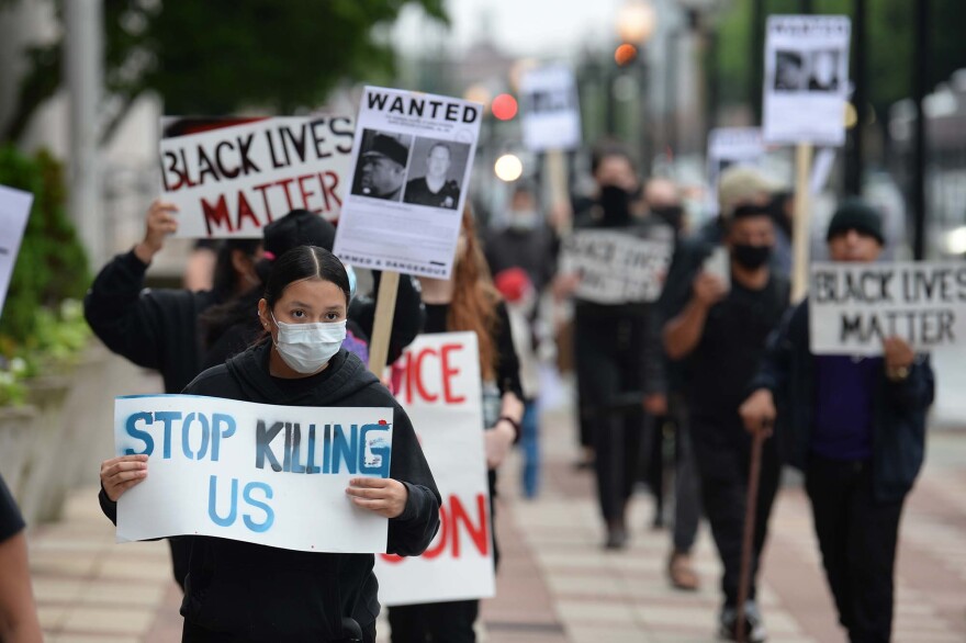 A group of protestors marched in New Haven in June, 2020 to show their solidarity in fighting for racial injustice. The protest followed the death of George Floyd, who was killed by a police officer in Minneapolis.