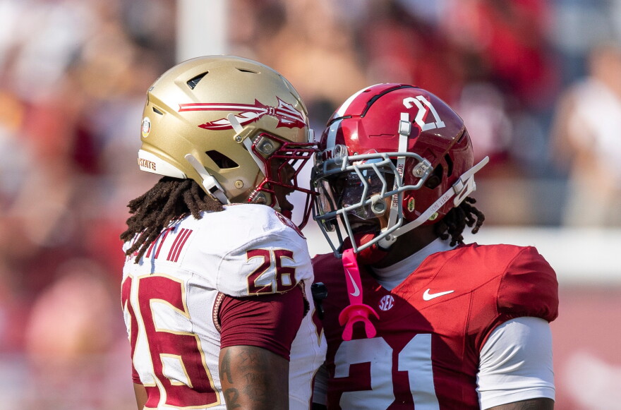 Florida State defensive back Ricky Knight III (26) and Alabama defensive back Dre Kirkpatrick Jr. (21) exchange words after a kickoff during the first half of an NCAA college football game Saturday, Sept. 19, 2026, in Tuscaloosa, Ala. (AP Photo/Vasha Hunt)