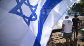 A team of volunteers prepare food for soldiers positioned on the Gaza border area near Sderot near Urim, Israel.