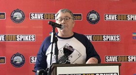 Dave Bohner speaking at a podium at "Save Our Spikes"