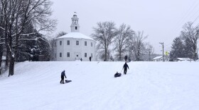 Families go sledding at the Round Church in Richmond on Monday afternoon.