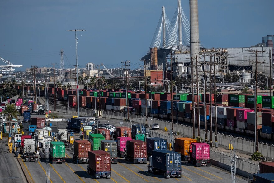 Semi-trucks exit Yusen Terminals at the Port of Los Angeles in San Pedro on Feb. 11, 2025.