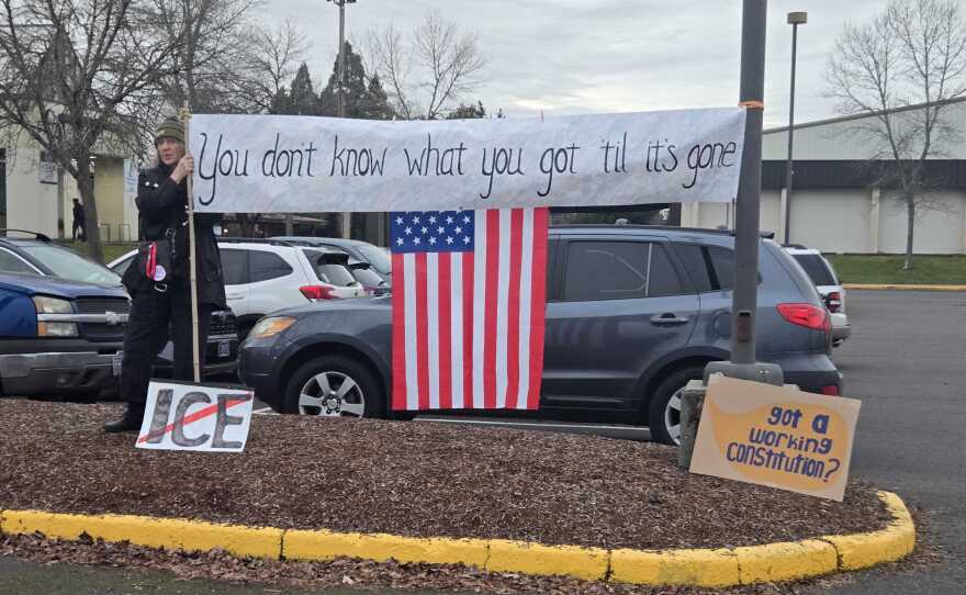 A protester outside the Lane Events Center in Eugene on Friday, Jan. 30, 2026.