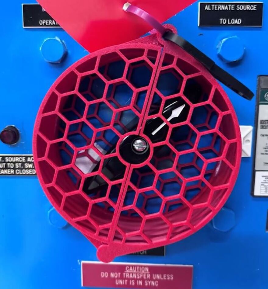 A 3D printed "clamshell" covering a wheel at the Surry Power Station.