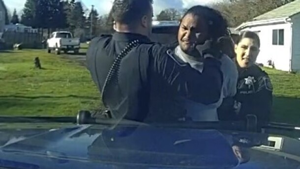 A former Eugene Police Officer appears to punch