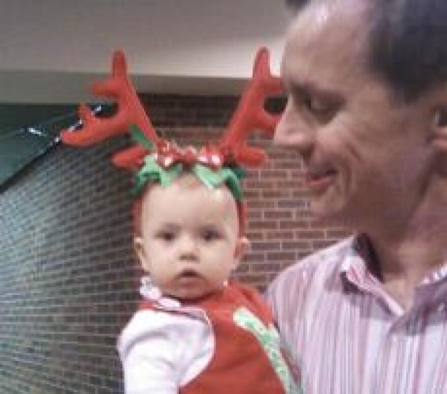 Jerry Squier made sure his daughter, 8-month-old Brooke, was dressed for the occasion last night at the Kentucky Christmas Chorus.
