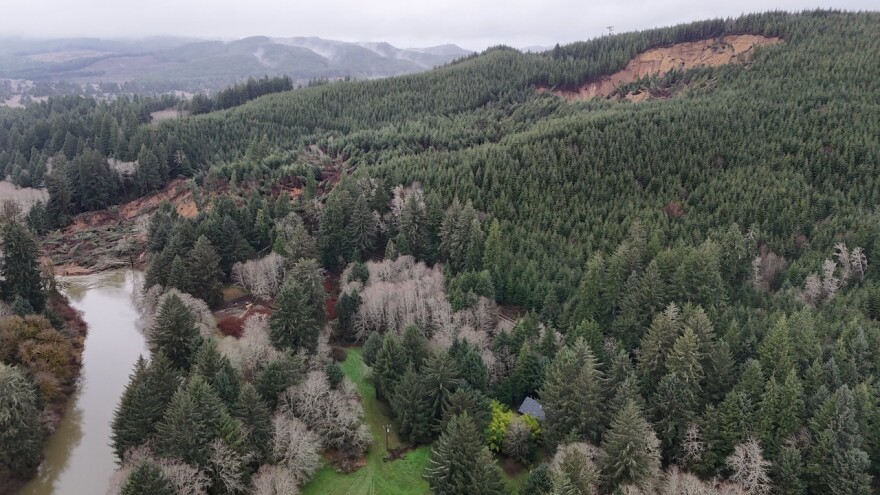 An overhead view of a landslide and a river