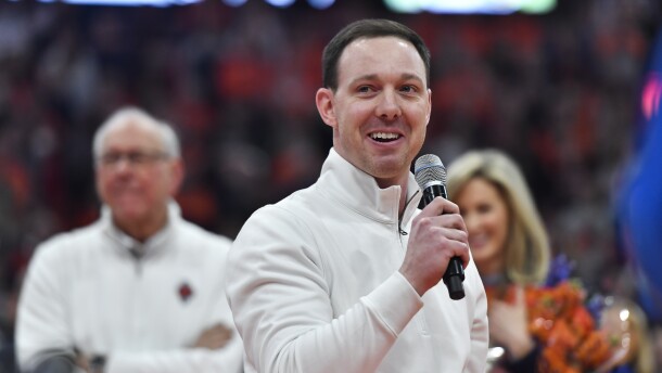 FILE - Syracuse assistant coach Gerry McNamara gives remarks at his jersey retirement ceremony after an NCAA college basketball game against Wake Forest in Syracuse, N.Y., Saturday, March 4, 2023. Gerry McNamara has signed a deal to take over as coach at Siena, deciding to leave Syracuse after two decades as a standout player, assistant and eventually ascending to associate head coach for the Orange. McNamara's signing was announced by Siena on Friday, March 29, 2024, and makes him a collegiate head coach for the first time. (AP Photo/Adrian Kraus, File)