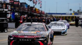 Driver Tyler Reddick leads other cars out to the track during a NASCAR Daytona 500 practice, Wednesday, Feb. 11, 2026, in Daytona, Fla. (AP Photo/Mike Stewart)