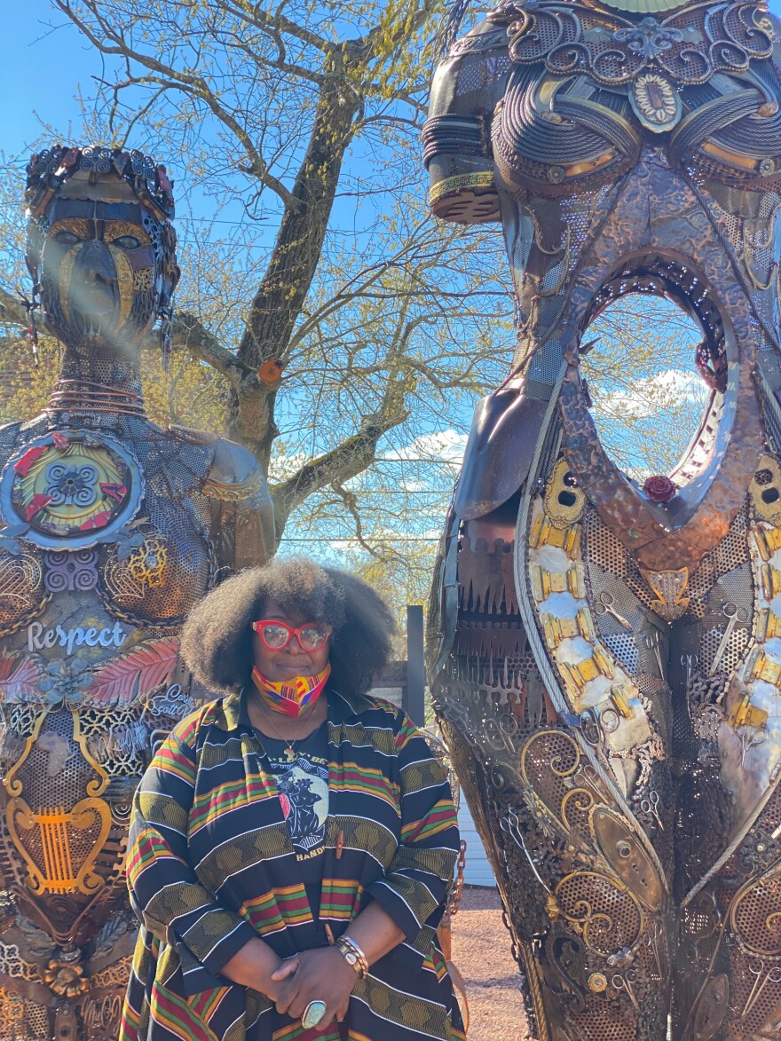 Michelle Browder in front of her statues, the Mothers of Gynecology.