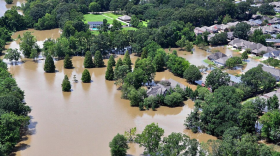 An aerial view taken from an MH-65 Dolphin helicopter shows severe flooding in a residential area of Baton Rouge, LA on Aug. 15, 2016. Coast Guard photo by Petty Officer 1st Class Melissa Leake.