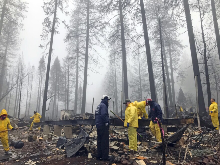 Volunteers search for remains at a mobile home park in Paradise, Calif., on Friday, Nov. 23. The Camp Fire destroyed the town.
