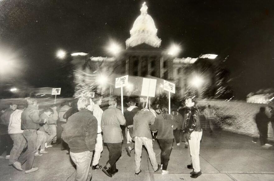 Rocky Mountain News Photograph Collection. Denver Public Library Collections Protestors march on the Colorado State Capitol on Nov. 3, 1992 following the passage of Amendment 2. Protestors were joined by Gov. Roy Romer.
