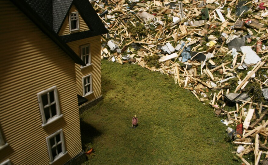 This figurine of a little girl is made from one taken from a model railroad set.