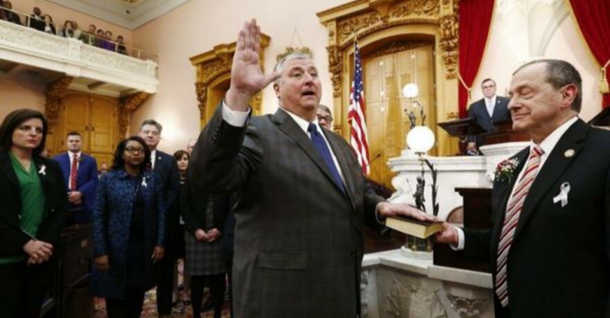 Former Ohio House Speaker Larry Householder, a Republican, being sworn into office by former House member David Leland, a Democrat on January 7, 2019