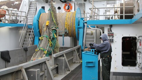 A crewmember on the fishing vessel Progress wraps up the 2025 pollock season in Unalaska. A storm caused millions of dollars in damage to the 130-foot trawler during the 2018 fishing season. Those kinds of incidents are rare, thanks in part to NOAA's marine forecast service.