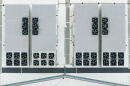 An aerial image directly above the roof of a data center. The structure contains rows of fans. 