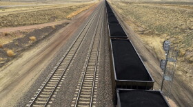 A train near hauls coal mined from Wyoming's Powder River Basin near Bill, Wyo., Tuesday, March 28, 2017. President Donald Trump's lifting of a federal coal leasing moratorium issued last year by President Barack Obama will allow new leasing of federal coal to resume in the basin and elsewhere. (Mead Gruver/AP)