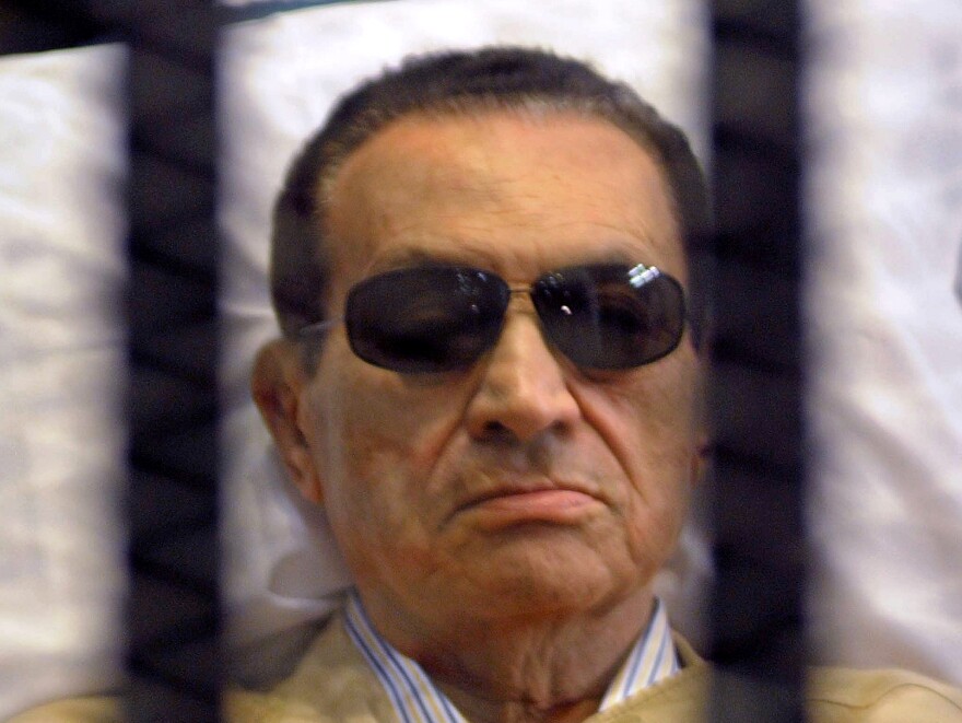 Ousted Egyptian president Hosni Mubarak sits inside a cage in a courtroom during his verdict hearing in Cairo on June 2, 2012. A judge sentenced Mubarak to life in prison after convicting him of involvement in the murder of protesters during the uprising that ousted him last year.