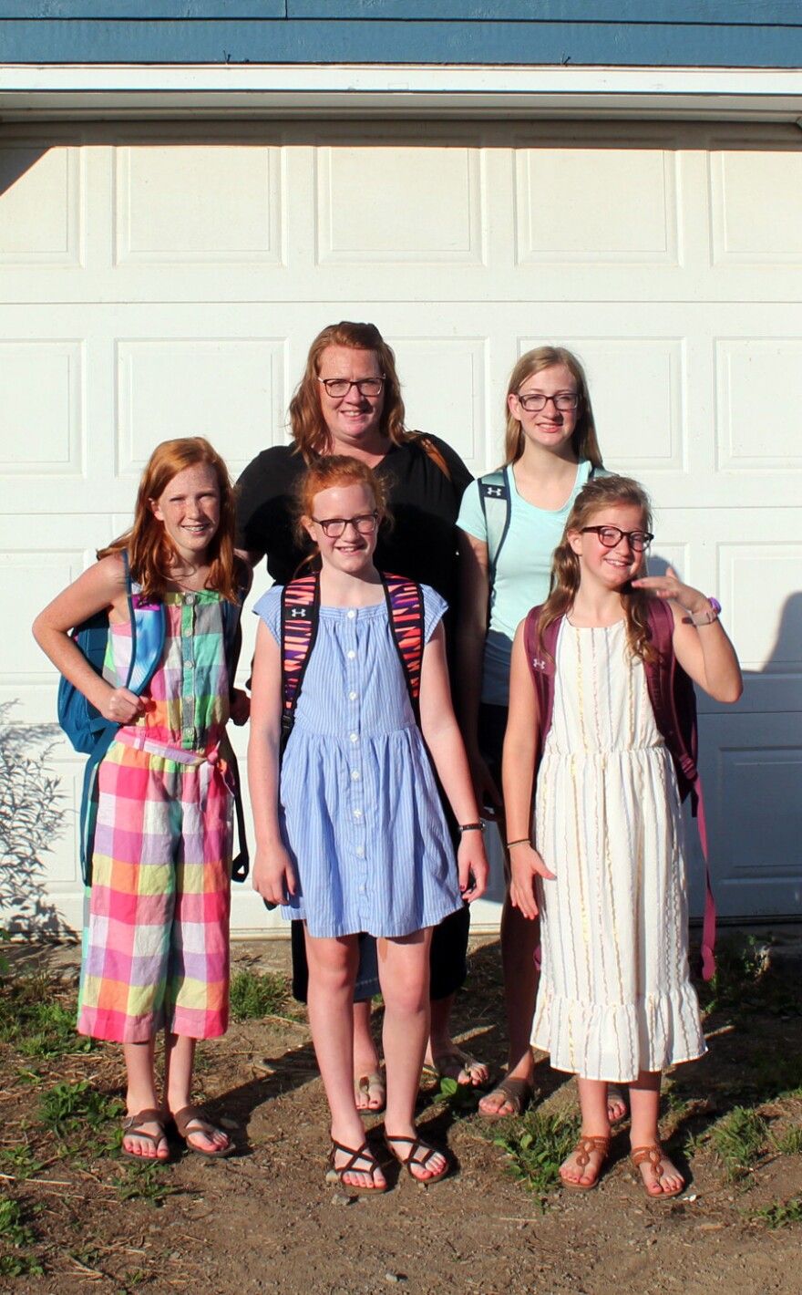 Ami Pierce and her daughters pose for a portrait on their farm before heading to school. Clockwise from left: Julia Pierce, Ami Pierce, Frankie Pierce, Aubrie Pierce and Charlie Pierce.