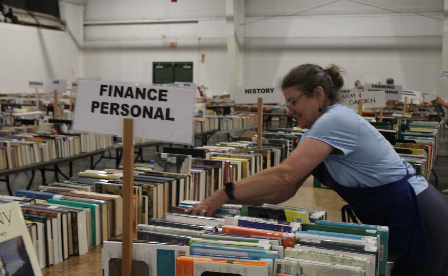 Susie Peace helps set up for the 2026 Friends of the Library Fall Book Sale. (Photo taken on September 14, 2026)