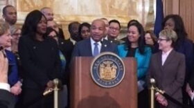 Assemlby Speaker Carl Heastie and other assembly members and supporters, just before passage of the New York State Dream Act bill on February 5th. CREDIT: KAREN DEWITT