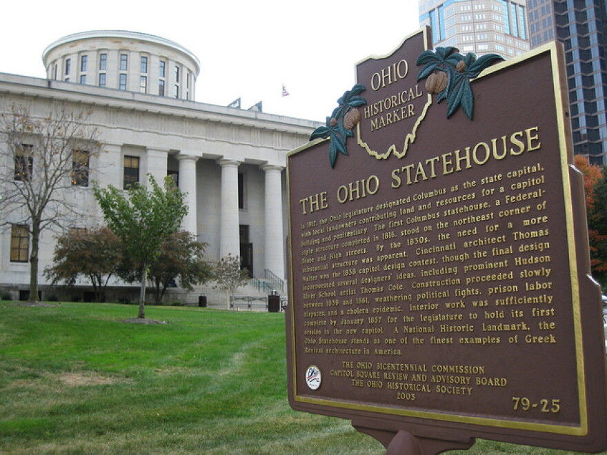 Ohio Statehouse in background with Historical Marker Plaque in the foreground