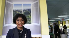 In this Aug. 26, 2020, photo Florida Rep. Anika Omphroy poses for a photograph at the Dutch Pot Jamaican Restaurant in Pembroke Pines, Fla. Omphroy, born to Jamaican parents, said she and her team are encouraging people to vote by mail and early on, especially those who vote at precincts that may now be closed due to the virus. Omphroy said she identifies with Democratic vice presidential candidate Sen. Kamala Harris as a first-generation daughter of immigrants, and she also thinks the candidate is easy to like. 