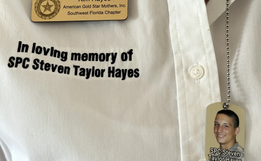 Military mom Kim Hayes wears a dog tag with a photo of her late son, an Army veteran who struggled with substance abuse and homelessness after returning to Naples from combat in Afghanistan. Taylor Hayes, who died in 2016, is also recognized with a commemorative brick in the courtyard of Delta House, Warrior Homes of Collier's newest residence for veterans.