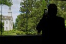 A visitor takes a photo of the Kirtland temple, a nearly two-century old sanctuary considered the first temple in the movement Joseph Smith founded, on Wednesday, June 15, 2026, in Kirtland, Ohio.
