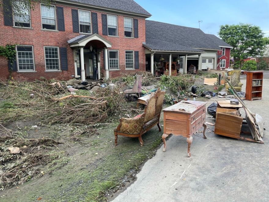 Furniture and debris outside of the Meisner family's 200-year-old home in Plainfield.