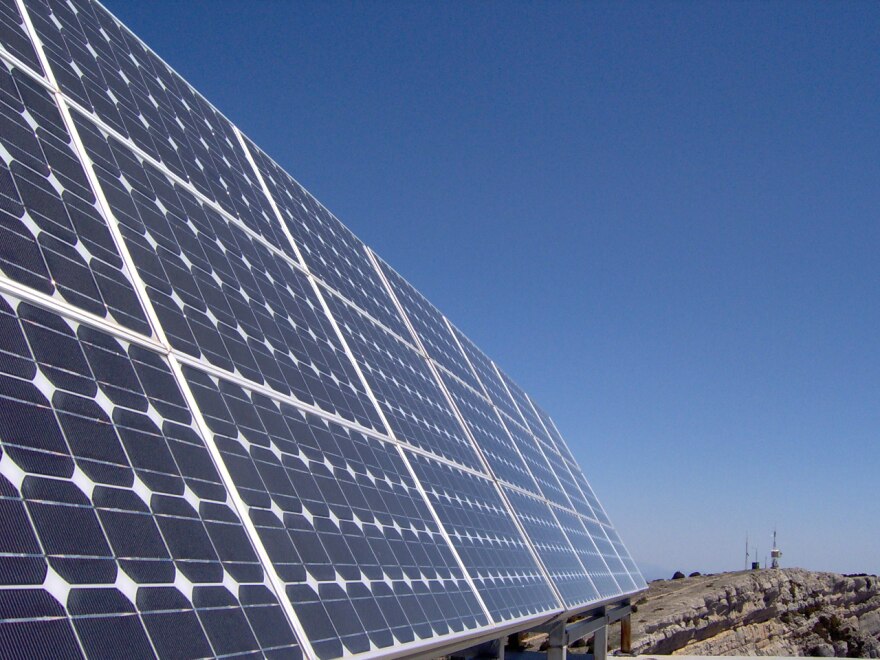 Solar panel against blue cloudless sky