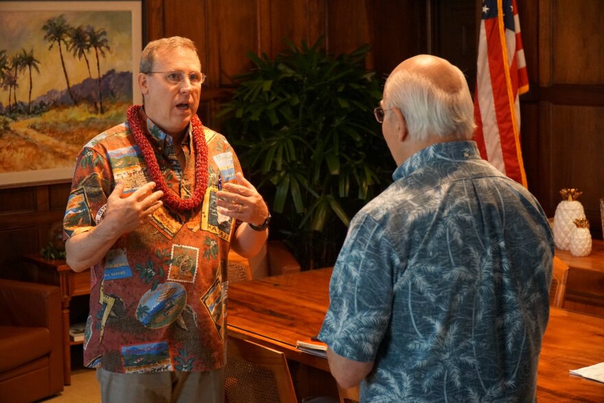 Incoming Honolulu Police Department Chief Arthur "Joe" Logan, left, speaking to Honolulu Mayor Rick Blangiardi after the Honolulu Police Commission selected Logan as the next police chief in May 2022.