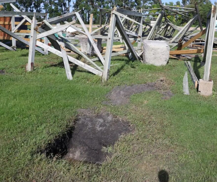 A chunk of concrete lies feet from the hole it once sat in to hold up the Sky-Vu screen. While the local weather station clocked the wind gusts at 75 miles per hour, Steve Novak thinks otherwise. "To lift those four-by-four cement chunks out of the ground and throw them 10 to 20 feet to the east, no, 75 miles an hour ain't gonna do that," said Novak | MPR News
