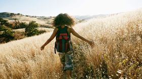 A woman hikes in a park. (Mint Images/Getty Images)