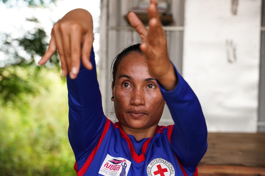 Sinet An, who was born with a disability, is the star of Cambodia's women's wheelchair basketball team, which celebrated their first win in an international tournament just before the pandemic hit. With Cambodia in lockdown, she hones her skills in virtual practice sessions from her home in Chuuok village in Kandal province, Cambodia. The photo is from June 24.