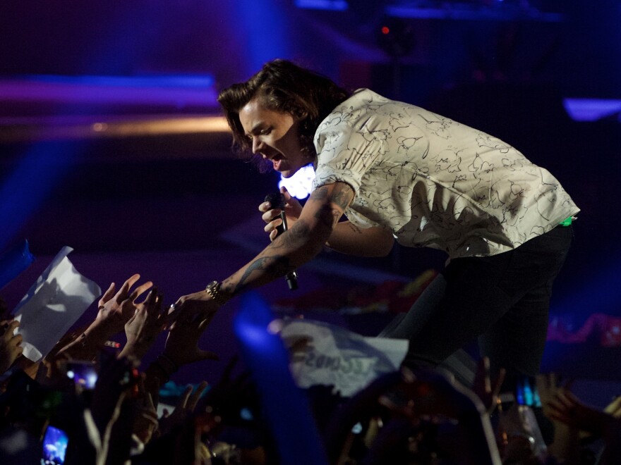 Harry Styles performs with One Direction in 2014.