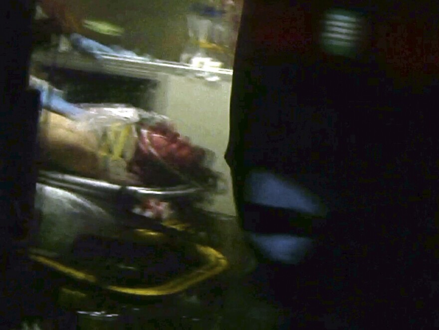 A still frame from video shows Boston Marathon bombing suspect Dzhokhar Tsarnaev through an ambulance window after he was captured in Watertown, Mass., on Friday.