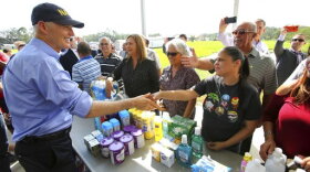 Florida Governor Rick Scott thanks Osceola County volunteers who are assisting with the relief effort for Puerto Rico in the wake of Hurricane Maria, during a visit to the Osceola County Services warehouse, in Kissimmee, Fla., Wednesday, Sept. 27, 2017. (Joe Burbank/Orlando Sentinel via AP)